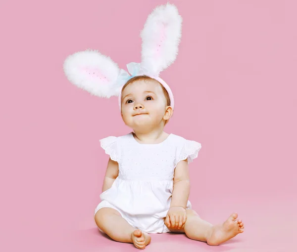 Sweet pink cute baby sitting in costume easter bunny with fluffy — Stock Photo, Image