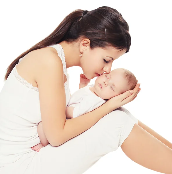 Young lovely mother kissing her baby — Stock Photo, Image