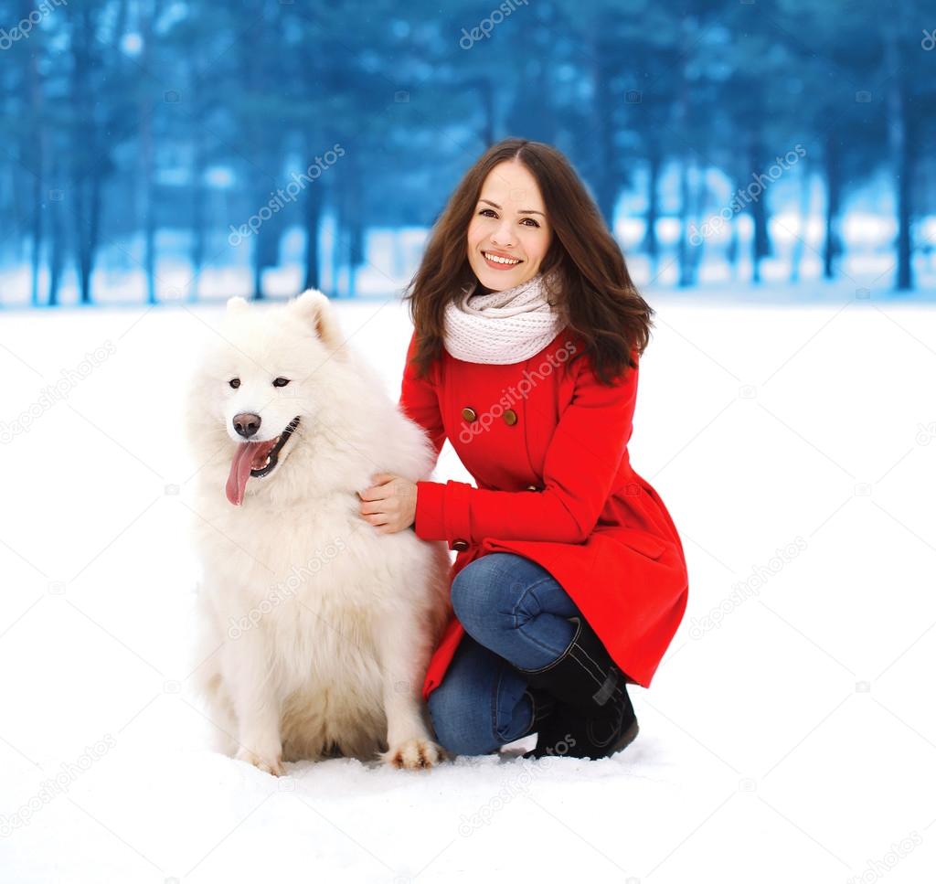 Winter, christmas and people concept - happy woman having fun wi