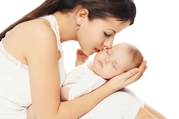 Portrait of young loving mother kissing her baby — Stock Photo, Image