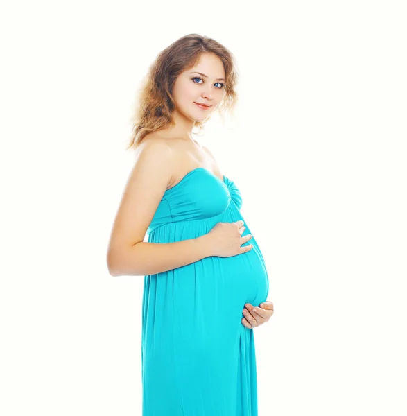 Portrait of young pregnant woman in dress on a white background Royalty Free Stock Images
