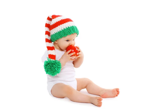 Christmas and childhood concept - baby in bright knitted gnome h — Stock Photo, Image