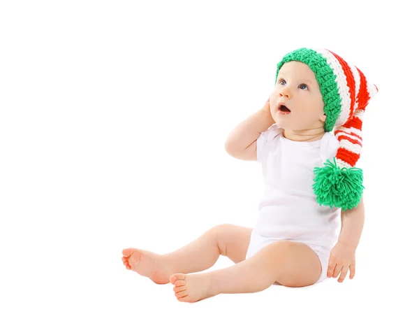 Cute baby in the hat gnome sitting and looking up — Stock Photo, Image