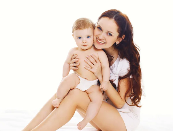 Family portrait of smiling mother with baby in diapers — Stock Photo, Image