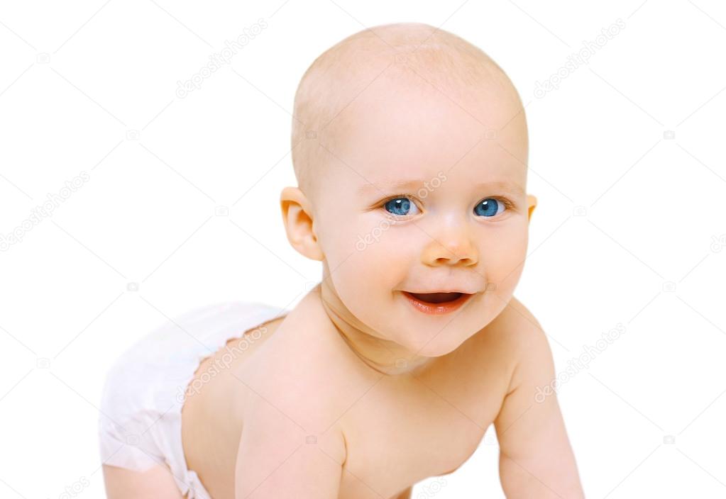 Portrait closeup smiling cute little baby crawls on a white back
