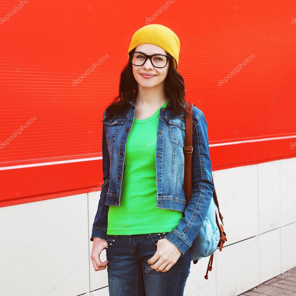 Portrait of pretty girl in glasses wearing a bright casual cloth