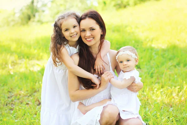 Happy young family, mother and two daughters childrens together — Stock Photo, Image