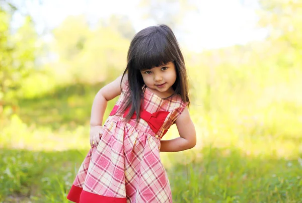 Portrait of little girl child wearing a dress outdoors in summer — 스톡 사진