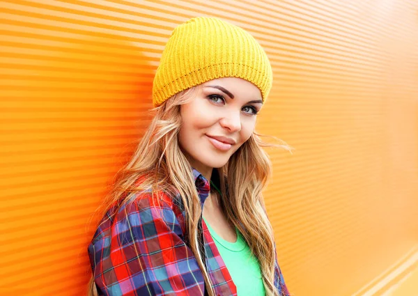 Portrait of pretty blonde woman in colorful clothes outdoors — ストック写真