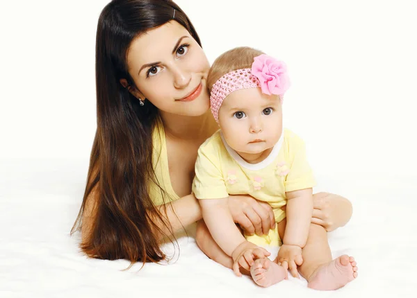 Portrait of beautiful mother and cute baby lying together — Stock Photo, Image