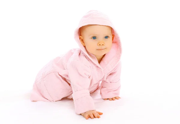 Portrait of cute little baby crawls in the pink bathrobe — Stock Photo, Image