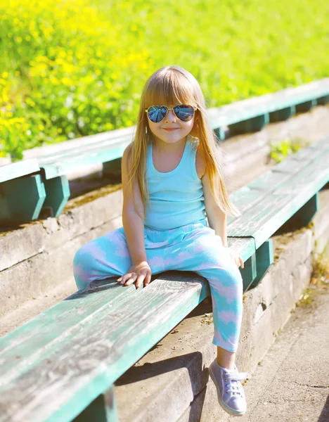 Fashion kid concept - little girl child wearing a t-shirt and su — Zdjęcie stockowe