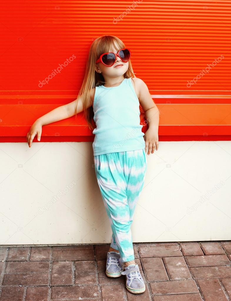 Fashion kid concept - stylish little girl child wearing a t-shir