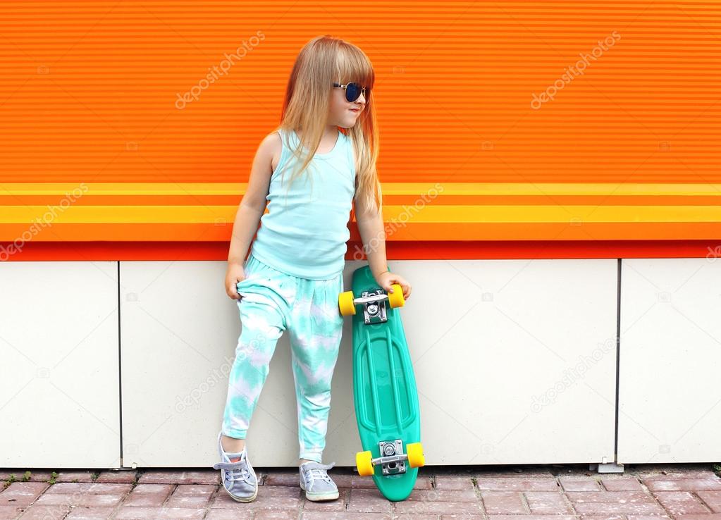 Fashion kid concept - stylish little girl child wearing a t-shir