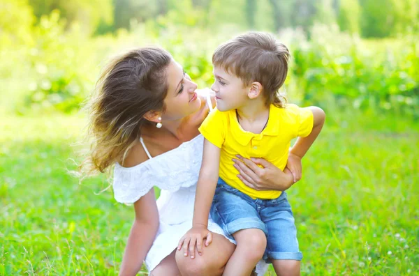 Happy mother with child son together outdoors in summer day — ストック写真