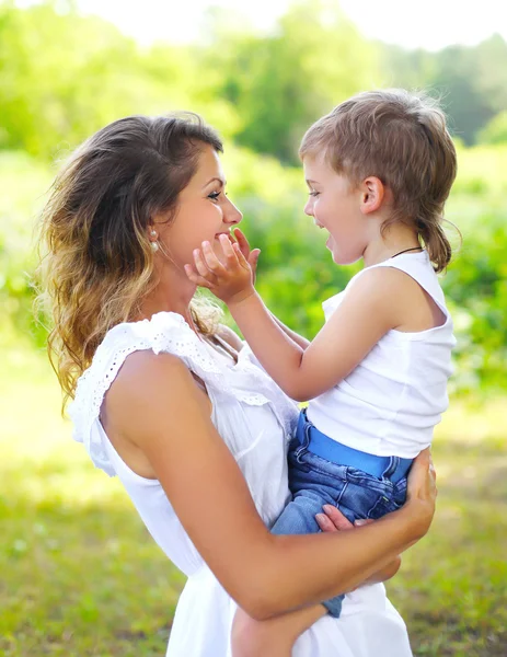 Mother with child son having fun outdoors in summer day — Stock Photo, Image