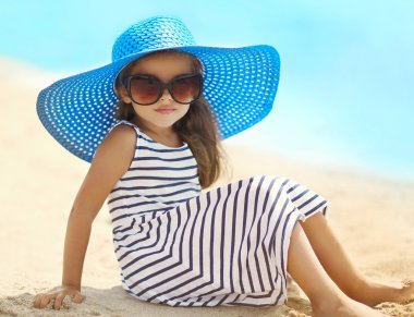 Summer, vacation and travel concept - portrait of pretty little 