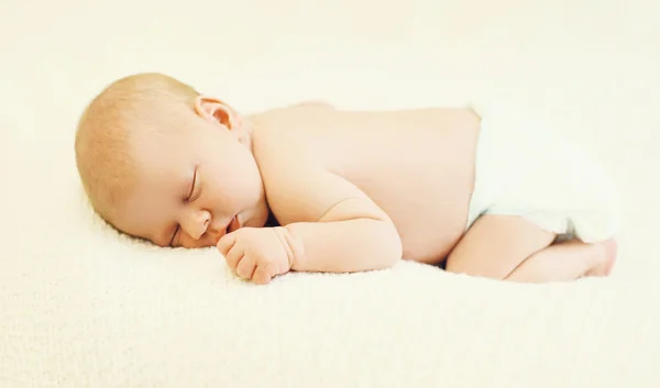 Sweet sleep baby lying on the bed at home — Stok fotoğraf