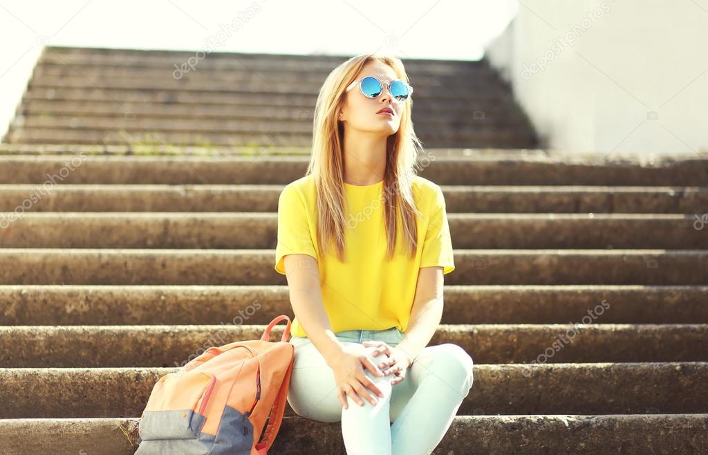 Street fashion, pretty stylish cool girl wearing a sunglasses an