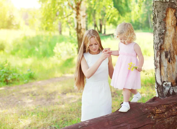 Mother and child walking together in summer warm day — Stock Photo, Image