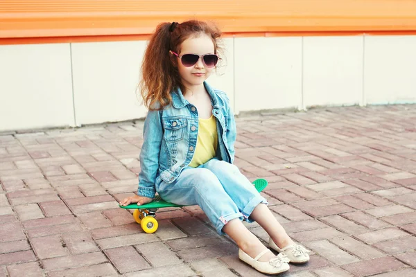 Fashion little girl child wearing a jeans clothes and sunglasses — Stock Photo, Image