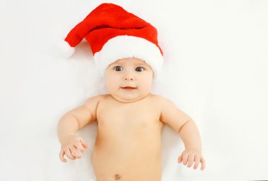 Christmas and family concept - beautiful baby in red santa hat l