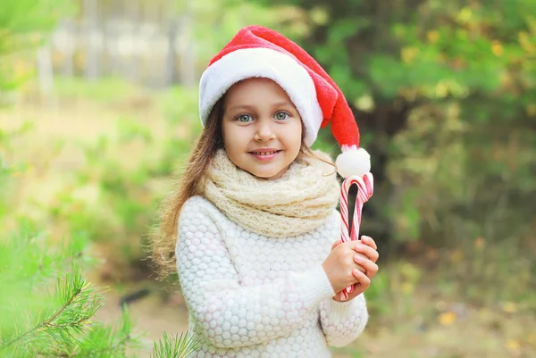 Christmas and people concept - portrait little girl child in san — Stock Photo, Image