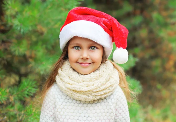 Christmas and people concept - portrait little girl child in san — Stock Photo, Image
