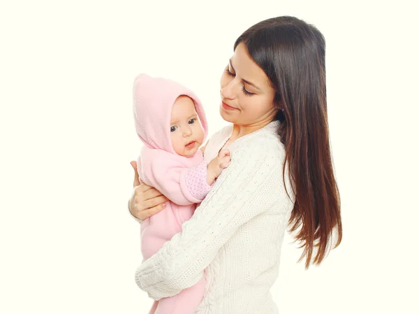 Portrait mother holding baby in the bathrobe after bath on white — Stock fotografie