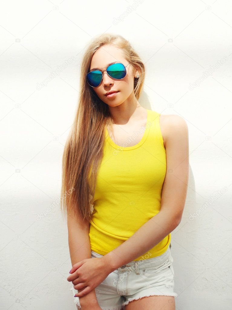 young pretty girl wearing a sunglasses and t-shirt in city