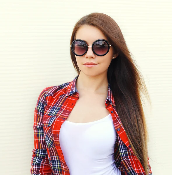 Fashion portrait pretty woman in sunglasses and checkered shirt — Stock Photo, Image