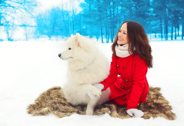 Winter and people concept - happy smiling young woman owner with — Stock Photo, Image