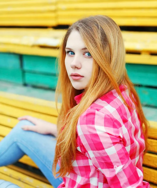 Portrait young girl wearing a checkered pink shirt in city — Stock Photo, Image
