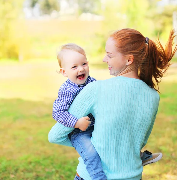 Happy cheerful smiling mother and son child having fun outdoors — Stock Photo, Image