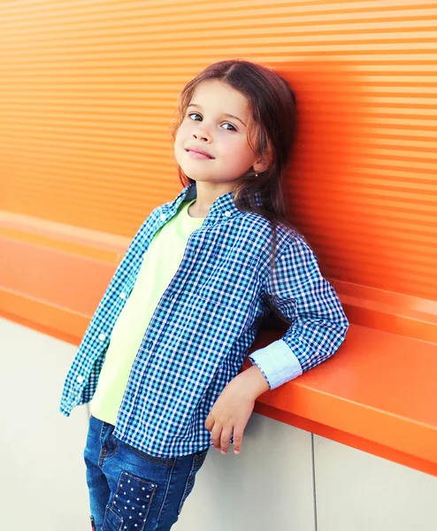 Portrait beautiful little girl child wearing a checkered shirt o — 图库照片