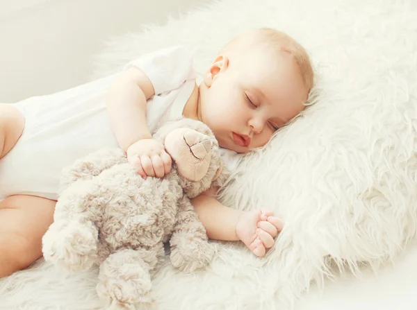 Cute baby sleeping on soft bed at home — Stock Photo, Image