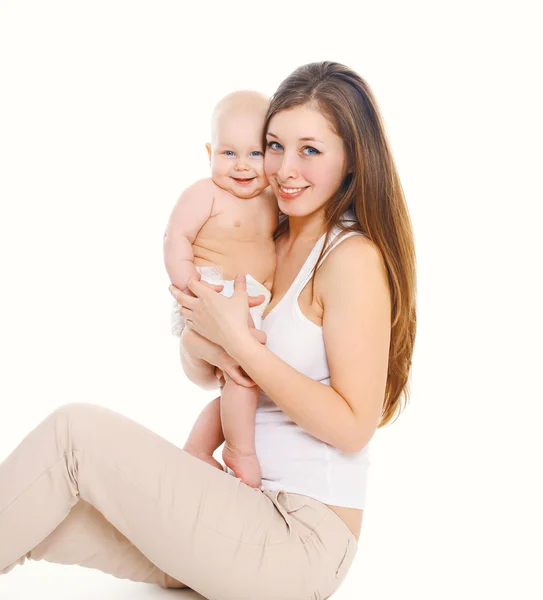 Happy smiling young mother and baby on white background — Stock Photo, Image