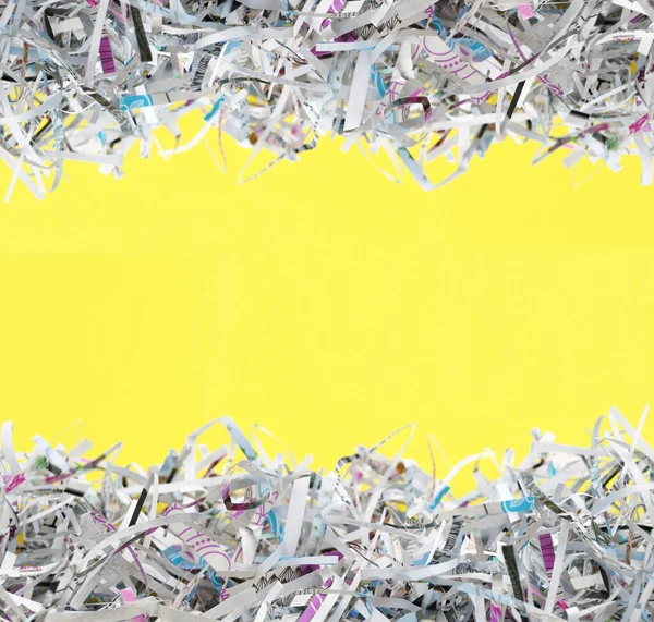 Shredded paper on light yellow background. Selective focus image.