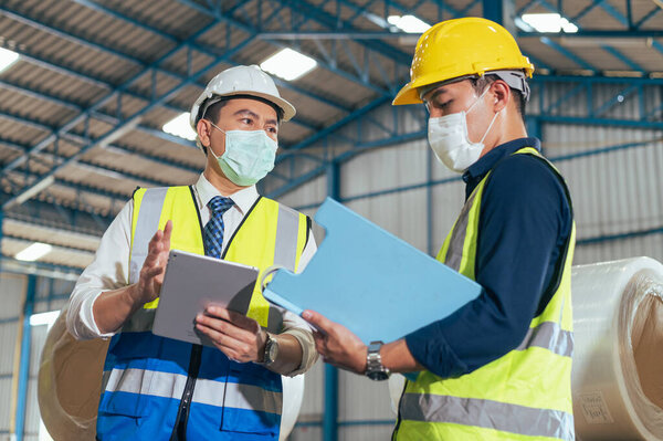 Workers Wearing Protective Face Mask Working Warehouse Covid Pandemic Concept Stock Photo
