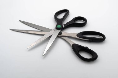 Zurich, Switzerland - November 8, 2020: Two office and sewing scissors for cutting fabric and paper