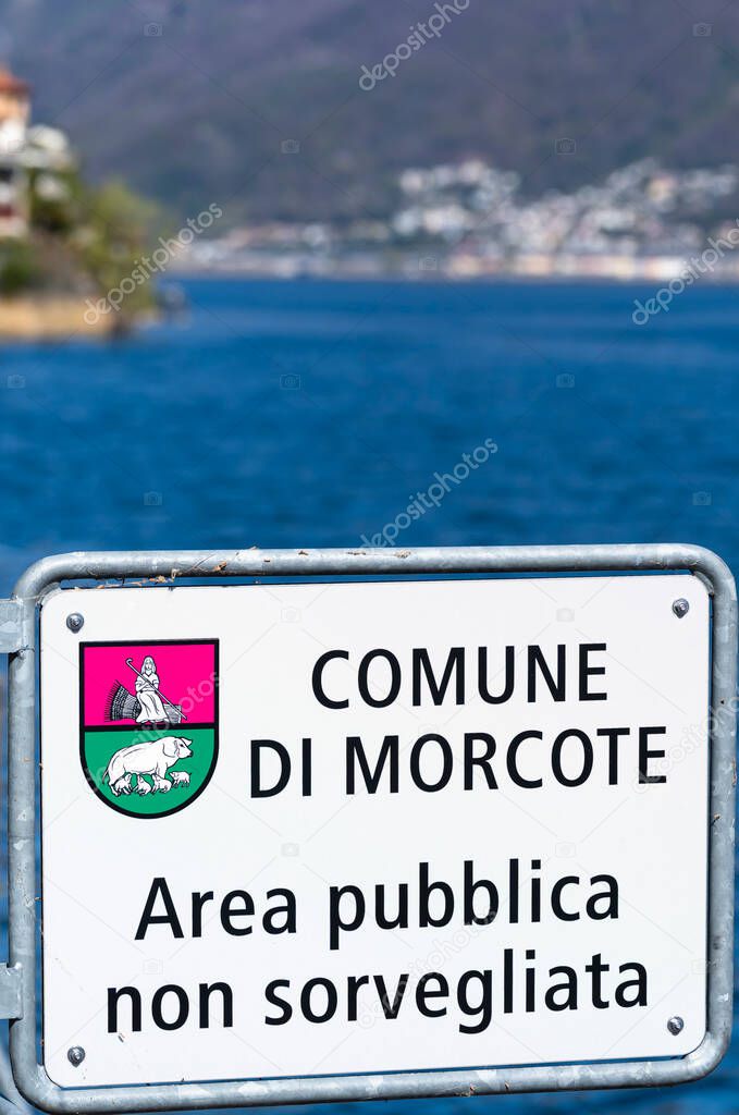 The picturesque village of Morcote in Ticino at the Lake Lugano is one of the most beautiful villages in Switzerland. Traduction of the sign: Municipality of Morcote. Unsupervised public area