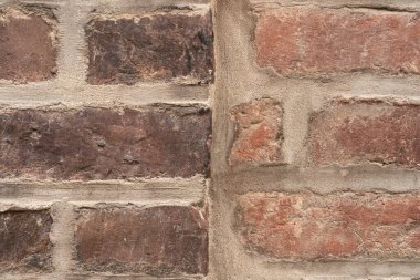 Soyut bir arka plan dokusu için Fransa 'nın Honfleur kentindeki eski bir tuğla duvarı kapatın..