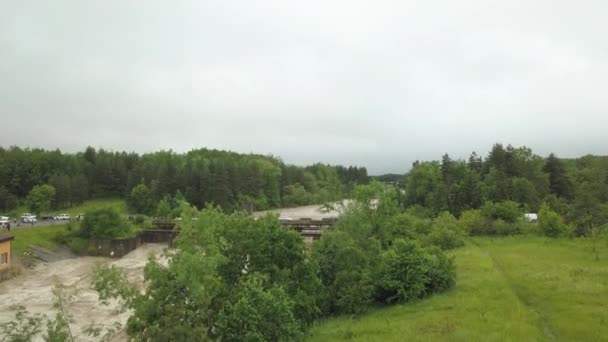 Aerial view of the bridge during floods. Extremely high water level in the river. — Stock Video