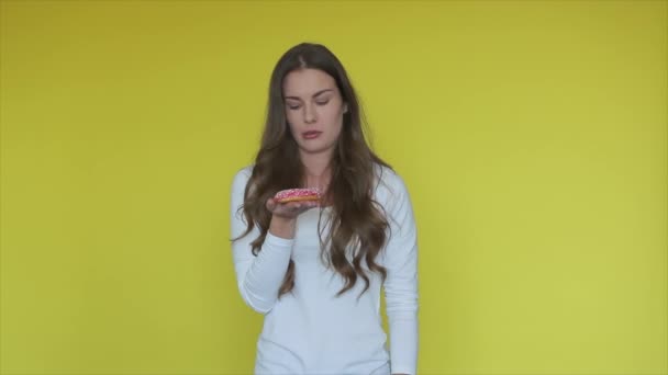 Tired Woman Holding Donut Yellow Background Woman Want Sweet Donut — Stock Video