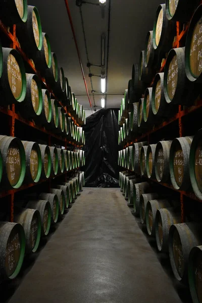 Wooden barrels where alcoholic beverages are kept so that they age.