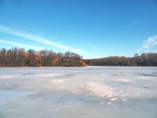 Nature in early spring. Ice melts on the lake. Spring landscape