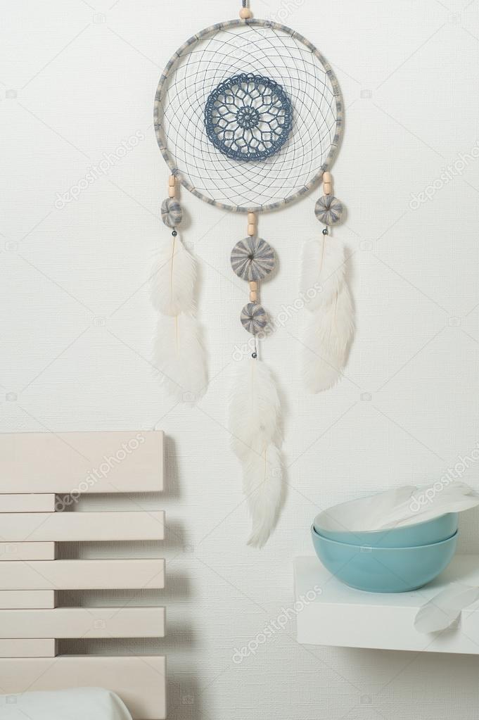 Blue dream catcher with white feathers
