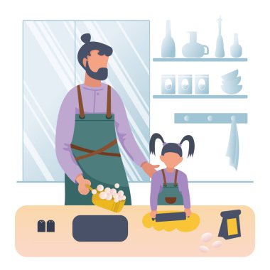 Baba küçük kızıyla yemek pişiriyor.