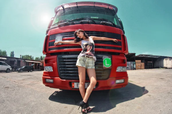 The girl on a background of a truck — Stock Photo, Image