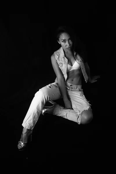 Women in the informal style of rock posing on a black background — Stock Photo, Image